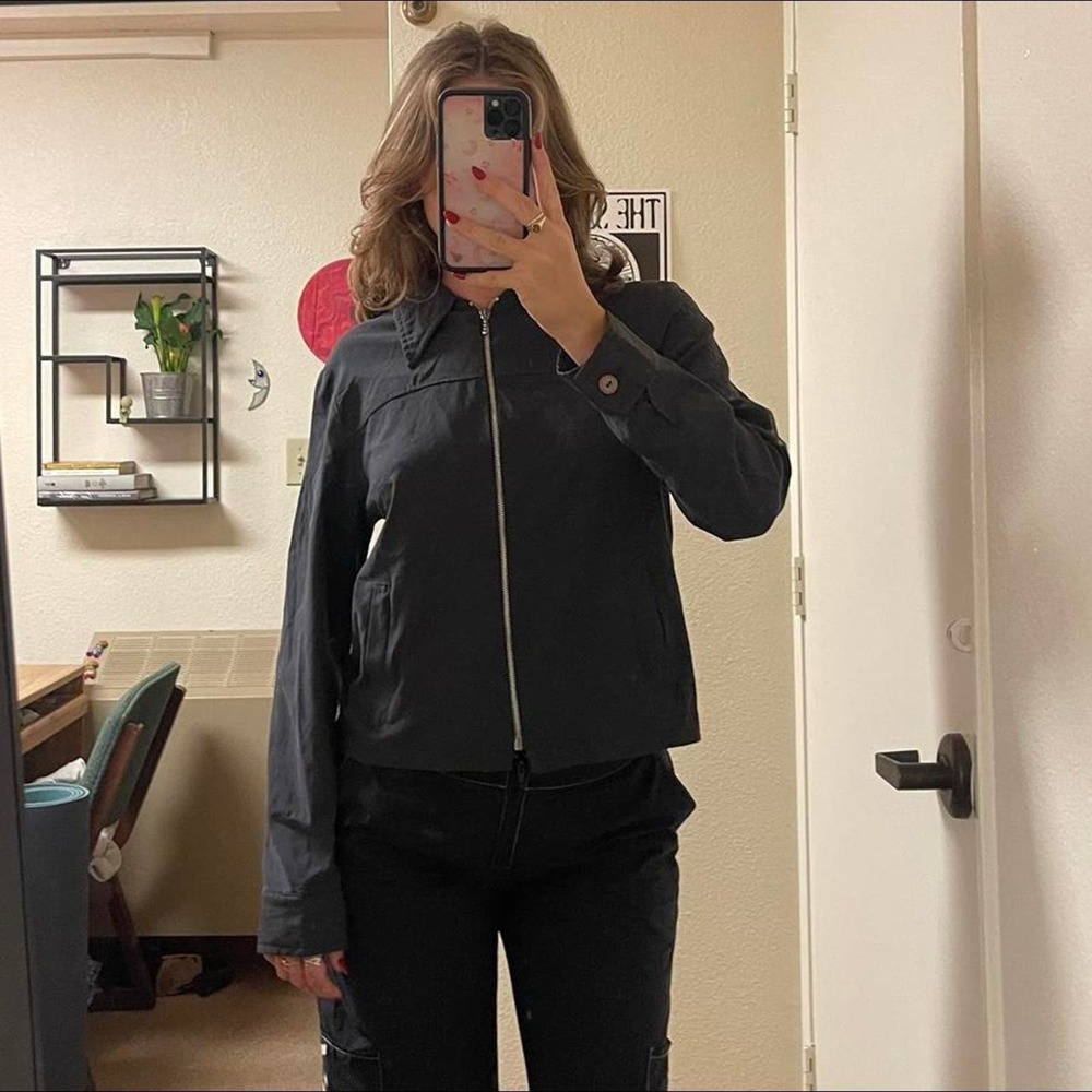 the black zip up collared long sleeve shirt